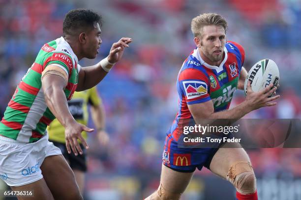 Brendan Elliot of the Knights is tackled during the round three NRL match between the Newcastle Knights and the South Sydney Rabbitohs at McDonald...