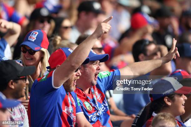 Knights fans celebrate during the round three NRL match between the Newcastle Knights and the South Sydney Rabbitohs at McDonald Jones Stadium on...