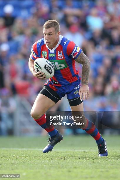 Trent Hodkinson of the Knights runs the ball during the round three NRL match between the Newcastle Knights and the South Sydney Rabbitohs at...