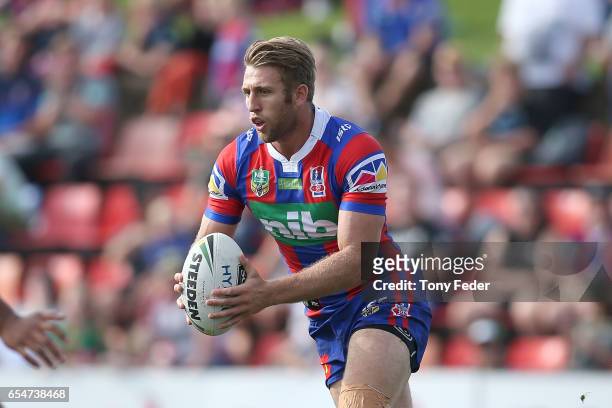 Brendan Elliot of the Knights runs the ball during the round three NRL match between the Newcastle Knights and the South Sydney Rabbitohs at McDonald...