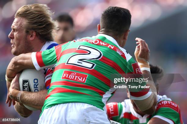 Nathan Ross of the Knights is tackled during the round three NRL match between the Newcastle Knights and the South Sydney Rabbitohs at McDonald Jones...