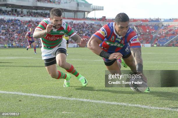 Peter Mata'Utia of the Knights scores a try during the round three NRL match between the Newcastle Knights and the South Sydney Rabbitohs at McDonald...
