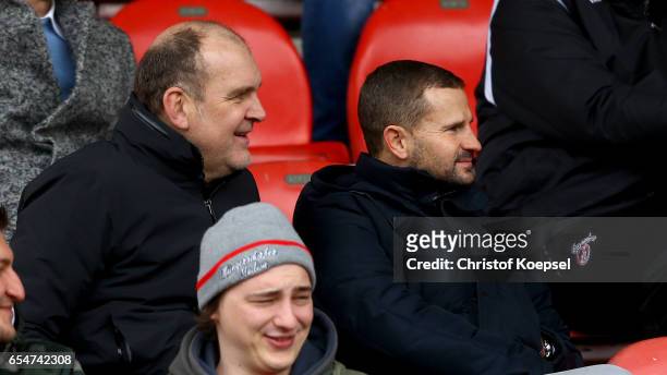 Manager Joerg Schmadtke of Koeln and manager Marc Arnold of Braunschweig sit on the tribune during the DFB Juniors Cup Semi Final Leg 1 macth between...