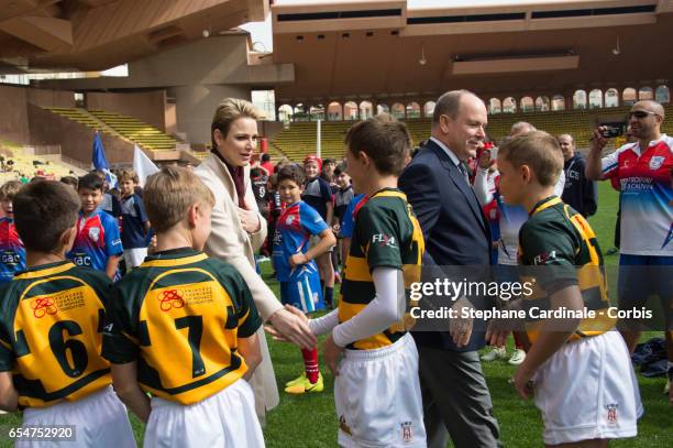 Prince Albert II of Monaco and Princess Charlene of Monaco with the Under-12 Rugby team of Cap Town, South Africa during the Sainte Devote Rugby...