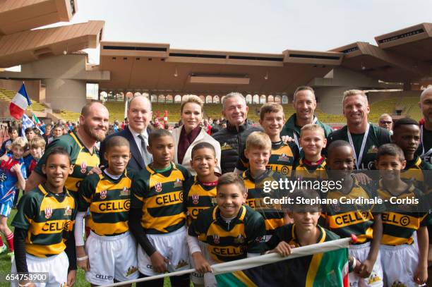 Prince Albert II of Monaco and Princess Charlene of Monaco with the Under-12 Rugby team of Cap Town, South Africa during the Sainte Devote Rugby...