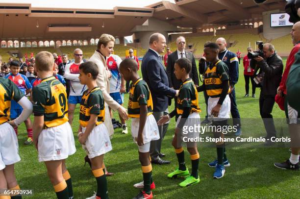 Prince Albert II of Monaco and Princess Charlene of Monaco with the Under-12 Rugby team of Cap Town, South Africa during the Sainte Devote Rugby...