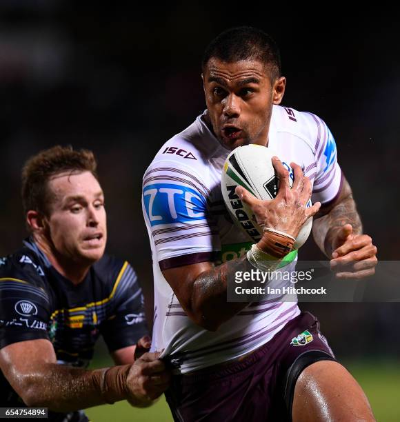 Frank Winterstein of the Sea Eagles is tackled by Michael Morgan of the Cowboys during the round three NRL match between the North Queensland Cowboys...