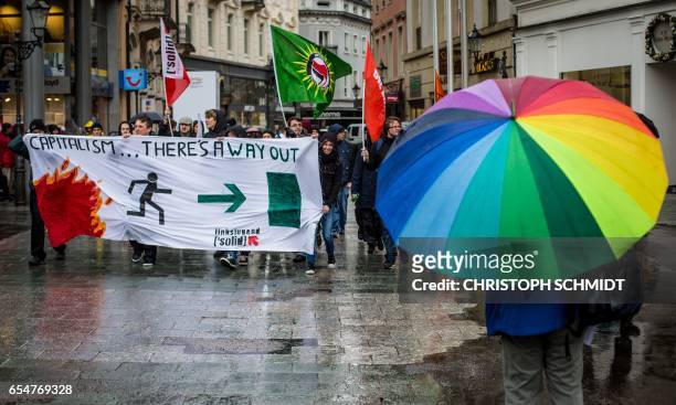 Demonstrators protest on the sidelines of the G20 Finance Ministers and Central Bank Governors Meeting in Baden-Baden, southern Germany, on March 18,...