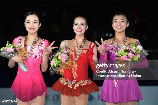 Marin Honda of Japan , Alina Zagitova of Russia and Kaori Sakamoto of Japan pose with their medals during the 4th day of the World Junior Figure...