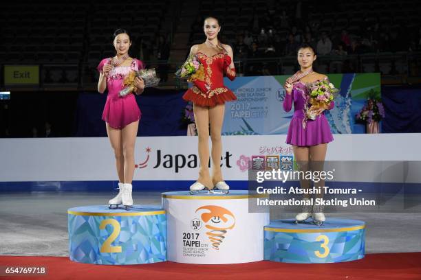 Marin Honda of Japan , Alina Zagitova of Russia and Kaori Sakamoto of Japan pose on the podium in the medal ceremony for the Junior Ladies Free...