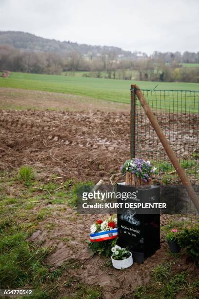 Picture taken on March 18, 2017 shows a memorial stone in memory of cyclist Antoine Demoitie, in Sainte-Marie-Cappel. Twenty-five-year-old Belgian...