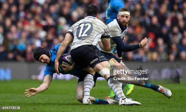 Carlo Canna of Italy is tackled by Alex Dunbar of Scotland during the RBS Six Nations match between Scotland and Italy at Murrayfield Stadium on...