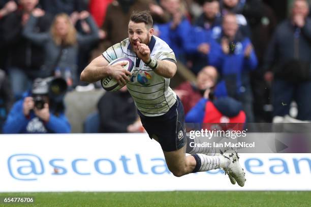 Tommy Seymour of Scotland scores his team's fourth try during the RBS Six Nations match between Scotland and Italy at Murrayfield Stadium on March...