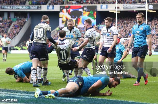 Tim Visser of Scotland celebrates scoring Scotland's third try during the RBS Six Nations Championship match between Scotland and Italy at...
