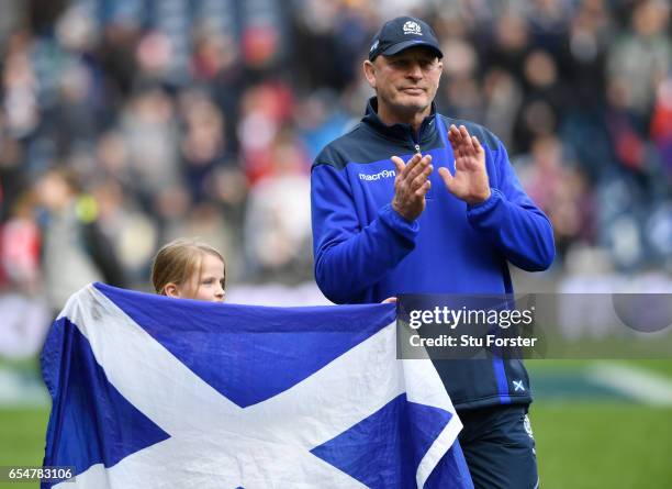 Vern Cotter the head coach of Scotland applauds the fans following his last game in charge during the RBS Six Nations match between Scotland and...