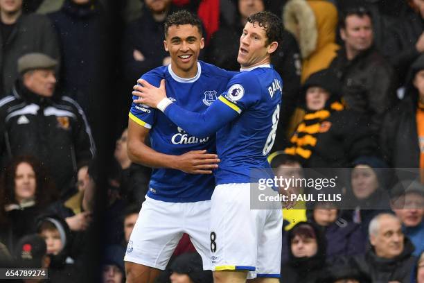 Everton's English striker Dominic Calvert-Lewin celebrates with Everton's English midfielder Ross Barkley after scoring the opening goal of the...