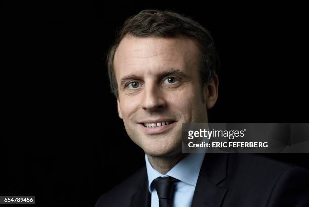 French presidential election candidate for the En Marche movement Emmanuel Macron poses for a photo session on March 7, 2017 at his campaign...