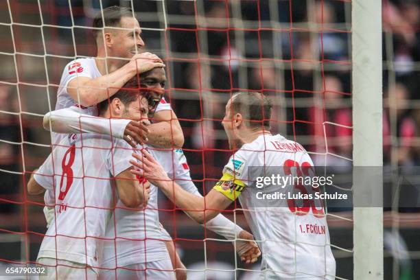 Anthony Modeste of Koeln celebrates his teams second goal with Milos Jojic , Christian Clemens and Matthias Lehmann during the Bundesliga match...