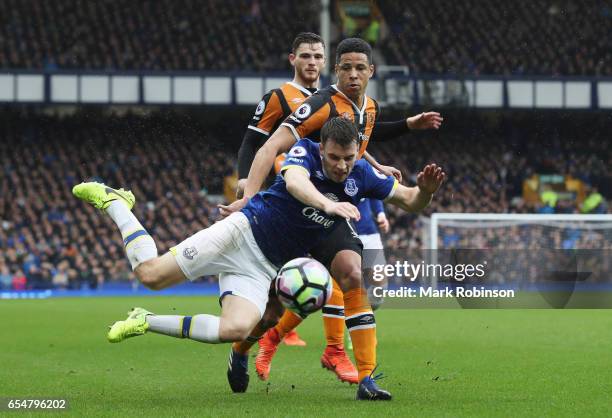 Seamus Coleman of Everton is challenged by Curtis Davies of Hull City during the Premier League match between Everton and Hull City at Goodison Park...
