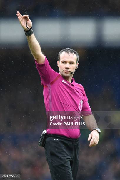 English referee Paul Tierney gestures during the English Premier League football match between Everton and Hull City at Goodison Park in Liverpool,...