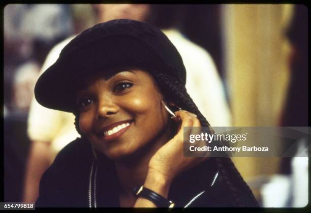 Close-up of American singer and actress Janet Jackson on the set of her film 'Poetic Justice' , 1993.