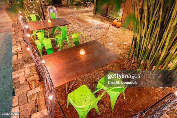 restaurant patio on rainey street in austin texas usa - austin nightlife stock pictures, royalty-free photos & images