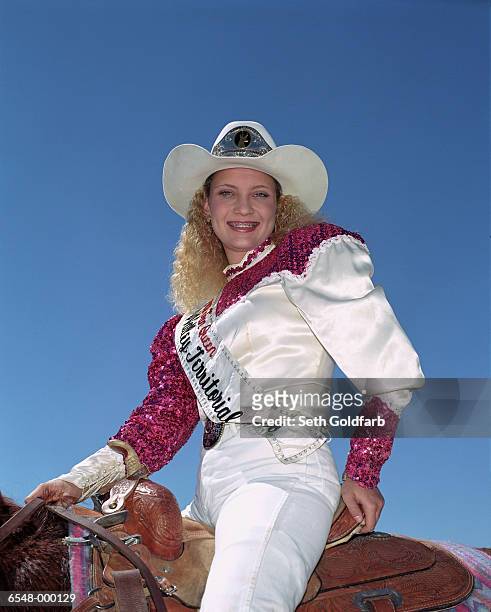 cowgirl sitting on horse - pantaloni di paillette foto e immagini stock