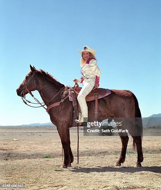 cowgirl sitting on horse - saddle stock pictures, royalty-free photos & images