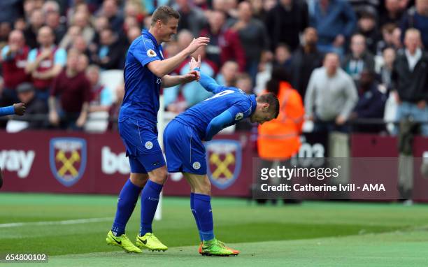 Jamie Vardy of Leicester City bows as he celebrates after scoring to make it 1-3 during the Premier League match between West Ham United and...