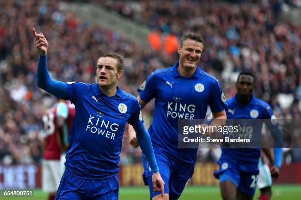 Jamie Vardy of Leicester City celebrates scoring his sides third goal with Robert Huth of Leicester City during the Premier League match between West...