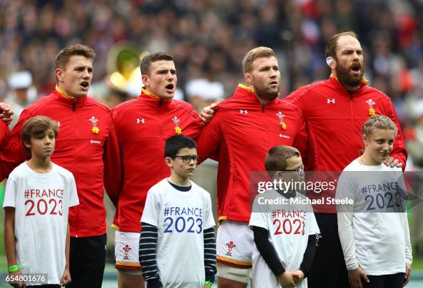 Jonathan Davies, Scott Williams, Ross Moriarty and Alun Wyn Jones of Wales sing their national anthem prior to kickoff during the RBS Six Nations...