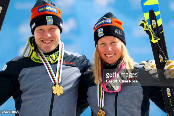 Victor Oehling Norberg and Sandra Naeslund of Sweden pose with their Gold medals on the podium after winning the Men's and Women's Ski Cross Finals...
