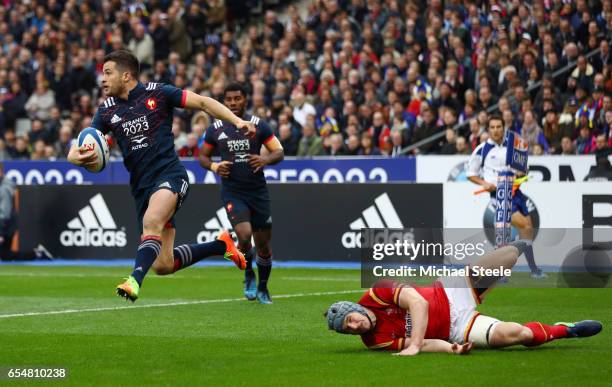 Brice Dulin of France evades the tackle from Jonathan Davies of Wales during the RBS Six Nations match between France and Wales at the Stade de...