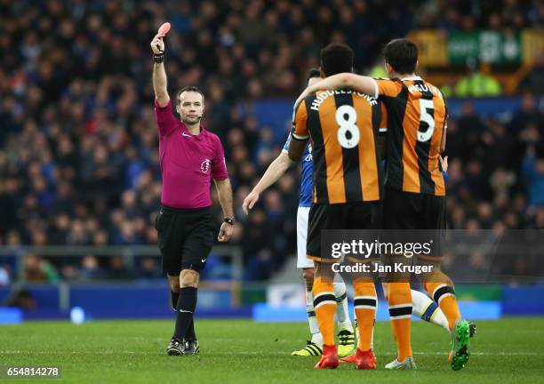 Referee Paul Tierney shows a red card to Tom Huddlestone of Hull City and he is sent off during the Premier League match between Everton and Hull...