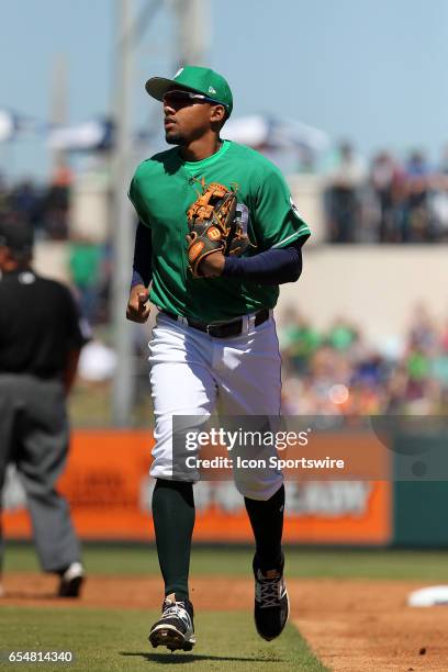 Dixon Machado of the Tigers trots off the field between innings during the spring training game between the New York Yankees and the Detroit Tigers...