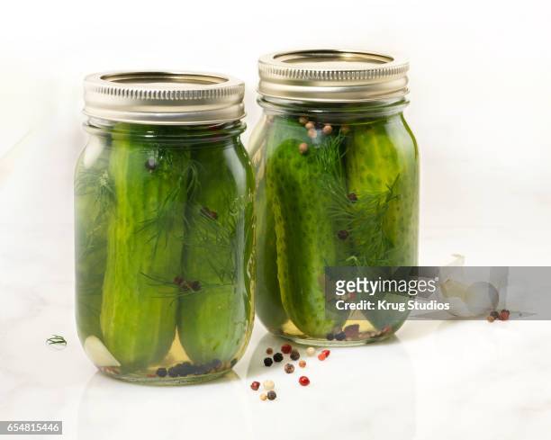 pickles in a jar - mason jar stock pictures, royalty-free photos & images
