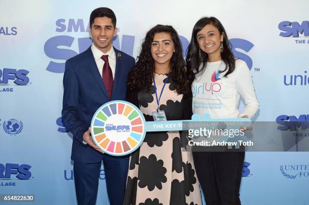 Young Sustainable Development Goals Advocates Karan Jerath, Noor Samee, and Sarina Divan pose with a key to Smur Village at the United Nations...