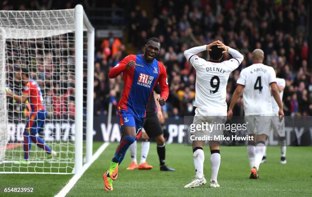 Christian Benteke of Crystal Palace celebrates after Troy Deeney of Watford scores a own goal for Crystal Palace first goal during the Premier League...