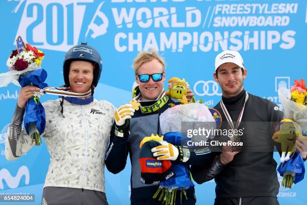 Jamie Pebble of New Zealand, Victor Oehling Norberg of Sweden and Francois Place of France pose with their medals on the podium after the Men's Ski...