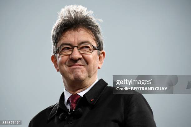 French presidential election candidate for the far-left coalition "La France insoumise" Jean-Luc Melenchon looks on as he delivers a speech during...