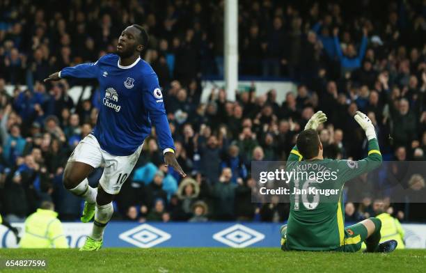 Eldin Jakupovic of Hull City reacts as Romelu Lukaku of Everton celebrates as he scores their third goal during the Premier League match between...