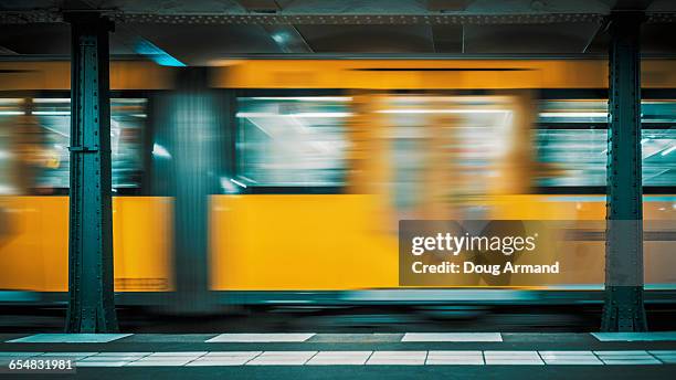 speeding train on berlin subway - berlin subway stock pictures, royalty-free photos & images