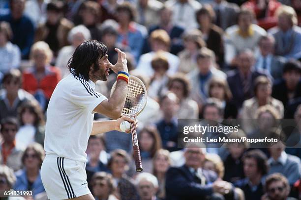 Romanian tennis player Ilie Nastase pictured in action during competition to reach the quarterfinals of the Men's Singles tournament at the Wimbledon...