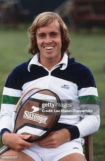 English tennis player John Lloyd posed with a Slazenger tennis racket and branded tennis shorts and top during a practice session in 1978.