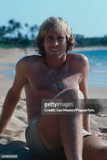 English tennis player John Lloyd posed wearing shorts on a beach in Maui during competition in the Hawaii Open in Hawaii, United States in October...