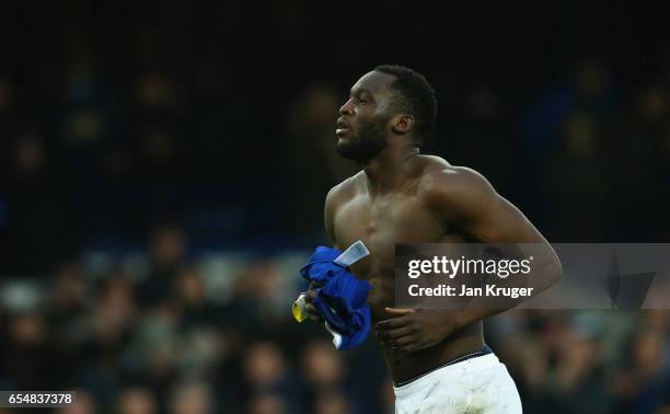 Romelu Lukaku of Everton removes his shirt to give to a fan after the Premier League match between Everton and Hull City at Goodison Park on March...