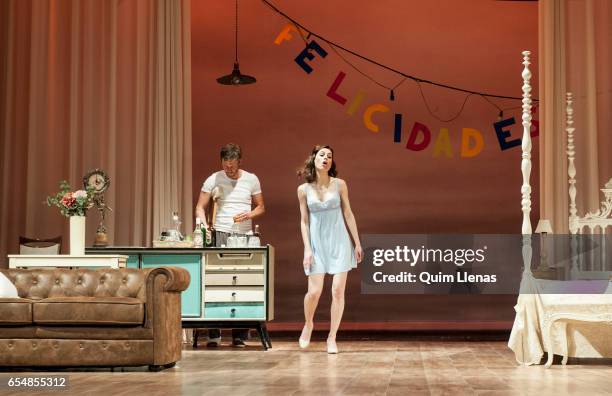 Spanish actors Eloy Azorin and Begona Maestre perform during the dress rehearsal of the play 'Una gata sobre un tejado de zinc caliente' by Tennessee...