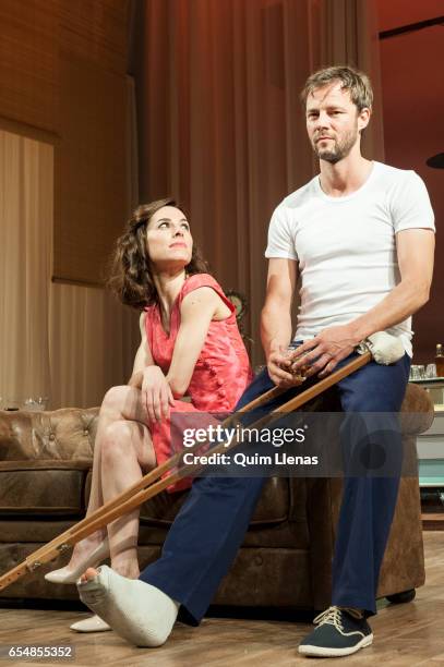 Spanish actors Eloy Azorin and Begona Maestre perform during the dress rehearsal of the play 'Una gata sobre un tejado de zinc caliente' by Tennessee...