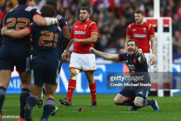 Camille Lopez of France sinks to his knees after converting a try to claim a 20-18 victory during the RBS Six Nations match between France and Wales...