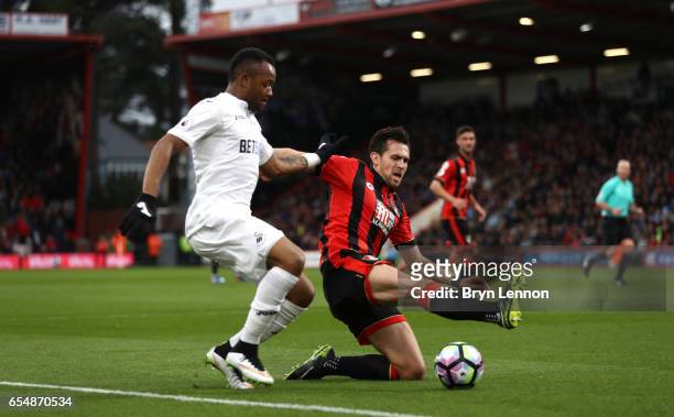 Charlie Daniels of AFC Bournemouth tackles Jordan Ayew of Swansea City during the Premier League match between AFC Bournemouth and Swansea City at...